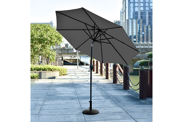 Add some shade to your home with this essential umbrella and resin base weight set. Designed with style and durability in mind, this complete set arrives ready for easy setup. The umbrella is built with an eight-rib steel frame, while gray polyester blocks UV rays. A push-button tilt mechanism lets you adjust as you please so you can get just the right amount of sun. Includes umbrella and base  | Bronze-tone powder coated aluminum frame with 8 steel ribs | Water- and fade-resistant gray polyester canopy with air ventilation  | Base made of a heavy duty resin compound; black, all- weather, water-resistant protective outdoor finish  | Easy crank open with tilt adjustment | Adjustable tightening knob for optimal stability | Assembly required | Ships in 2 boxes