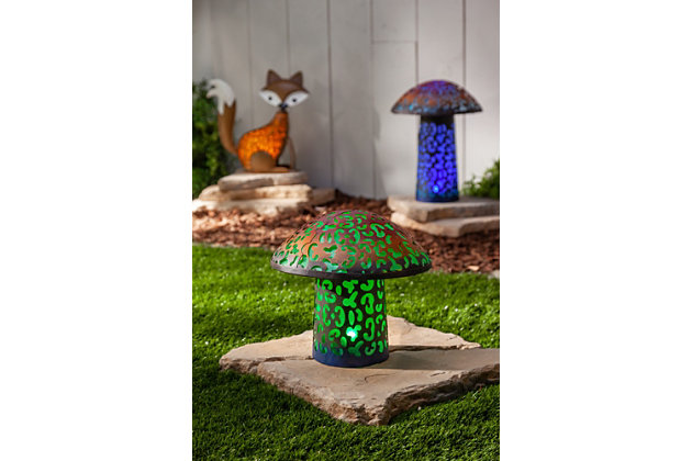 Capture the the imagination of your family and neighbors with this solar powered metal mushroom in your garden. Standing 15.75-inches tall, it will tower over low blossoms and accent taller ones with a bright blue hue, glowing from within by an LED light that comes on as the sun goes down. Detailed metal work gives this garden decor an authentic and colorful look with with illuminated cut-outs and gradient color finish. This mushroom will make an unique addition to your yard, garden, or illuminating a grouping at night to the delight of friends and neighbors.Made of metal and pvc | A colorful garden accent, this metal led mushroom stands 15.75-inches high and is solar powered to light up your garden or patio | This woodland feature is powered by a solar collector with 1 aa ni-cd rechargeable solar battery for long life | The bright blue hue is generated by a led light in the solar collector disk | The bright blue hue is generated by a led light in the solar collector disk | This garden accent is made from metal with a colorful gradient finish and blue pvc film inner body allowing for a colorful illumination | Suitable for indoor or outdoor use | Arrives assembled