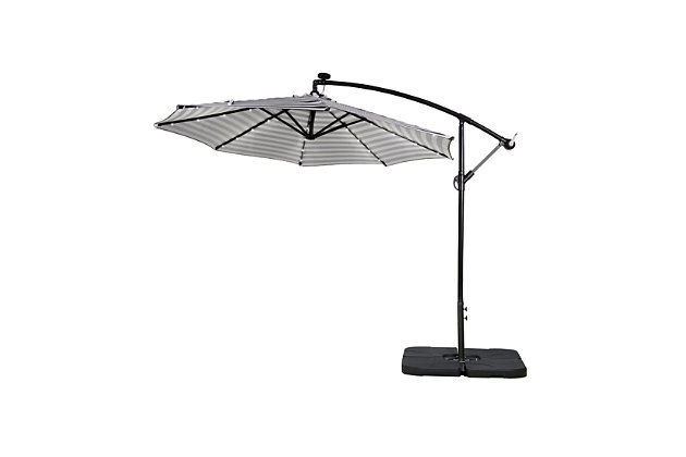 Not your average umbrella, the Lucia features a solar panel that uses the power of the sun to illuminate the bulbs lining each steel rib inside. When fully charged, these lights last eight to 10 hours so, day or night, this umbrella helps you have a blast outdoors. The base is included, so this set is ready to put up.Includes light up LED umbrella and 4-piece fillable weight base  | Powder coated aluminum frame with 8 steel ribs with lights | Water- and fade-resistant black and white striped polyester canopy with air ventilation  | Black base weights are made from heavy duty plastic  | Base weight includes a carrying handle  | Easy crank open with tilt adjustment | Fill capacity for base weight: 200 lbs. of sand or 6 liters of water | Assembly required | Ships in 2 boxes