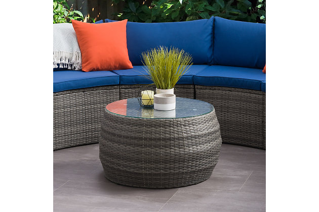 A trend-driven update on your average outdoor piece, this round table in blended grey has sleek lines that will usher your patio right into summer. As stylish as it is functional, its tempered glass with suction grips, makes sliding a thing of the past and its UV resistant resin wicker maintains a bright and fresh appearance year after year. It's the perfect place to gather around!Made with galvanized powder coated steel for durability | Made using Weather rated PVC for long lasting enjoyment | 5mm inset clear tempered safety glass table top with suction grips to keep glass in place | Leveling legs for perfect balance | Galvanized powder coated steel helps resist rust | Low maintenance