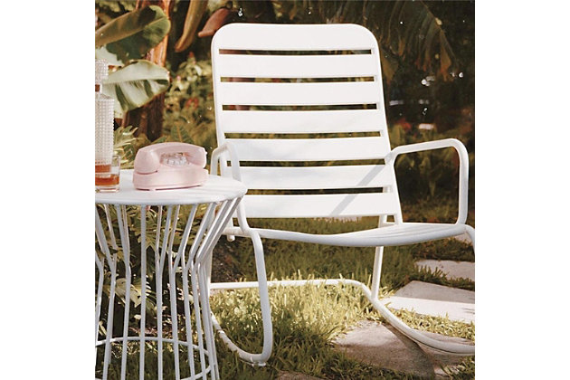 Roberta loves listening to classic rock while sipping whiskey sours (don't forget the extra cherries). You won't find a cooler rocking chair than the Roberta indoor/outdoor chair by Novogratz, with its bold color, curvy silhouette and smooth moves. Made of durable, weather-resistant steel with a white powdercoat finish | Assembly required