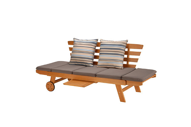 This indoor/outdoor daybed is constructed of FSC Eucalyptus, a sustainable, eco-friendly wood sourced from managed forests and certified by the Forest Stewardship Council. It is naturally weather-resistant and its inherent oil content will protect against moisture, UV rays, decay and rot. This functional and attractive lounger features a classic slatted design, with removable/tie-down five section seat and side cushion padding. Backrest includes two decorative complimenting color striped cushions. Strong polyester fabric cushion covers are water, stain, mildew and fade-resistant. Both side panels can be adjusted to provide a complete lay flat surface. Slide out tray table and easy transport wheels add convenience and mobility. This finely crafted wood furniture is perfect for use on porch, patio, yard or poolside.Dimensions: 75"L x 27"W x 30"H | FSC (Forest Stewardship Council) Certified | Highest quality Eucalyptus Grandis wood | Galvanized steel hardware | Slatted wood design | Side panels adjust for lay flat position | Pull out tray table and convenient wheels | Weather-resistant slate gray removable seat cushion & striped throw pillows