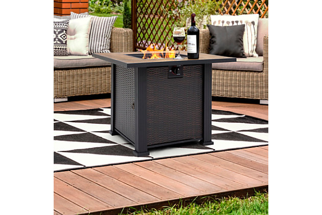 With its slate tile and steel mantel, this handcrafted propane fire pit table features the classic elements of high-end furniture, with the durability of weather-resistant steel. Its decorative base cleverly conceals a propane tank (not included) and control panel, making it an attractive centerpiece for your outdoor living space. Complete with a 50,000 BTU stainless steel burner, this fire pit lets you enjoy all the ambiance of a classic fire without the mess of tending ashes. Adding to the elegance, it includes lava rock that beautifully accents its flames.Made of metal and ceramic | All-weather frame with durable black finish | Lava rock | 20-pound propane tank required (sold separately) | Assembly required