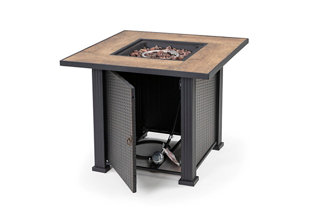 With its slate tile and steel mantel, this handcrafted propane fire pit table features the classic elements of high-end furniture, with the durability of weather-resistant steel. Its decorative base cleverly conceals a propane tank (not included) and control panel, making it an attractive centerpiece for your outdoor living space. Complete with a 50,000 BTU stainless steel burner, this fire pit lets you enjoy all the ambiance of a classic fire without the mess of tending ashes. Adding to the elegance, it includes lava rock that beautifully accents its flames.Made of metal and ceramic | All-weather frame with durable black finish | Lava rock | Protective cover | 20-pound propane tank required (sold separately) | Assembly required