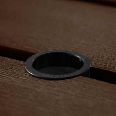Detail of wood grain on brown wood slat.