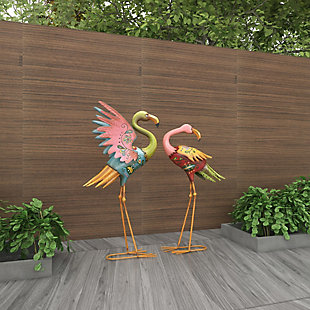 Add coastal flair to your home with this vibrant set of two flamingo sculptures. These figurines are bound to impress your guests with their marvelous design and uniqueness. Made of iron and showcasing impressive hand-painted floral patterns and multicolor finishes, each feathered friend features detailed characteristics and metal feet that serve as a sturdy base. What a charming way to add an artistic twist to your favorite indoor or outdoor spaces. Set of 2 flamingo sculptures | Features a coastal-inspired design for a laid-back vibe | Iron construction results in a long-lasting design for your outdoor space | The sculptures display a brilliant color palette; bright pink, yellow, blue, green and red finishes | Suitable for indoor and outdoor use | Wipe clean with a dry cloth | Items measure 18"L x 7"W x 32"H and 17"L x 7"W x 28"H; weight: 4.4 lbs.