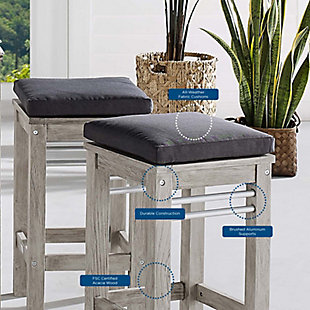 Invoke the refreshing feel of coastal style with the Wiscasset Outdoor Patio Wood Bar Stool. This FSC-certified acacia wood pub stool has a slatted base with a reinforced center beam and matte aluminum supports for a strong seating experience. The densely padded all-weather cushion comes with a durable machine washable cover. Complete with ribbons to secure the cushion onto the seat base, this modern outdoor bar stool will effortlessly enhance the decor of your patio, deck, porch or poolside.Set of 2 | FSC-certified acacia wood base | Brushed aluminum supports | All-weather washable cushion cover | Textured light gray grain | Assembly required