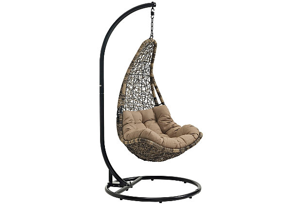 Escape to a place of quiet comfort with the Abate Swing Chair. Made with a luxurious synthetic rattan weave, and plush all-weather fabric cushion, Abate's organic design inspires simple joys and pleasurable moments. Abate Hanging Chair comes with a sturdy powder-coated steel frame and hanging chain apparatus that works well to enliven your patio, backyard, porch, or poolside decor. Stand-alone swinging chairs are also popularly used in indoor lounge, living, or bedroom spaces. Abate is weather and UV resistant.Stand-Alone Swing Hammock Chair | Sturdy Powder-Coated Steel Frame | Washable White Polyester Cushion | UV Resistant and All-Weather | Luxurious Synthetic Rattan Weave | Weight Capacity: 265 Pounds | Assembly Required