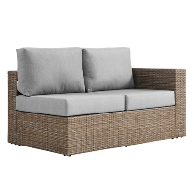Close-up of synthetic rattan weave and cushions on an outdoor sofa