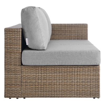 Close-up of the loveseat cushion and tag on the chair