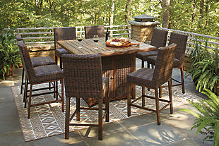 Turn your backyard space into your own piece of paradise with the Paradise Trail outdoor table with fire pit. Though this outdoor table looks remarkably like wood, it’s made of sturdy, rust-proof aluminum that’s perfectly suited for al fresco living. Enhancing the rustically refined aesthetic: side panels accented with all-weather, handwoven resin wicker. The result may look high maintenance, but rest assured, this outdoor fire pit table is anything but. With the press of a button, ignite a flickering flame that dances over a bed of glass beads. And with room for up to eight, it’s one highly accommodating outdoor bar table.Accommodates up to 8; bar stools sold separately | Door conceals gas propane tank (not included) | Rust-proof aluminum frame with wood-look tabletop | Side panels accented with all-weather, handwoven resin wicker | 56" square fire pit table with CSA-approved 55,000 BTU stainless steel burner, glass beads, burner cover and enclosed storage area with shelves | Battery-operated ignition system with adjustable flame control; battery included | Convertible to natural gas | Assembly required | Assembly of fire pit table provided with in-home delivery; connection to propane tank or connector hose not provided | Comes with protective weather cover | Estimated Assembly Time: 60 Minutes