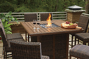 Turn your backyard space into your own piece of paradise with the Paradise Trail outdoor table with fire pit. Though this outdoor table looks remarkably like wood, it’s made of sturdy, rust-proof aluminum that’s perfectly suited for al fresco living. Enhancing the rustically refined aesthetic: side panels accented with all-weather, handwoven resin wicker. The result may look high maintenance, but rest assured, this outdoor fire pit table is anything but. With the press of a button, ignite a flickering flame that dances over a bed of glass beads. And with room for up to eight, it’s one highly accommodating outdoor bar table.Accommodates up to 8; bar stools sold separately | Door conceals gas propane tank (not included) | Rust-proof aluminum frame with wood-look tabletop | Side panels accented with all-weather, handwoven resin wicker | 56" square fire pit table with CSA-approved 55,000 BTU stainless steel burner, glass beads, burner cover and enclosed storage area with shelves | Battery-operated ignition system with adjustable flame control; battery included | Convertible to natural gas | Assembly required | Assembly of fire pit table provided with in-home delivery; connection to propane tank or connector hose not provided | Comes with protective weather cover | Estimated Assembly Time: 60 Minutes