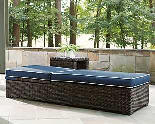 Style. Comfort. Quality. Value. The Grasson Lane chaise lounge with cushion really goes to town, giving you the total package for outstanding outdoor living. Crafted to withstand the elements, this outdoor chaise’s resin wicker base and rust-proof aluminum frame ensure carefree living, while the plush cushion covered in fade-resistant Nuvella® fabric provides stylish appeal. Comfy and casual, it's perfect for use inside or out.Outdoor chaise with cushion | All-weather resin wicker handwoven over durable aluminum frame | Powder coated aluminum resists rusting and fading | Zippered cushion covered in high-performing Nuvella® fabric | All-weather foam cushion core wrapped in soft polyester | Imported fabric and fill | Clean fabric with mild soap and water, let air dry; for stubborn stains, use a solution of 1 cup bleach to 1 gallon water