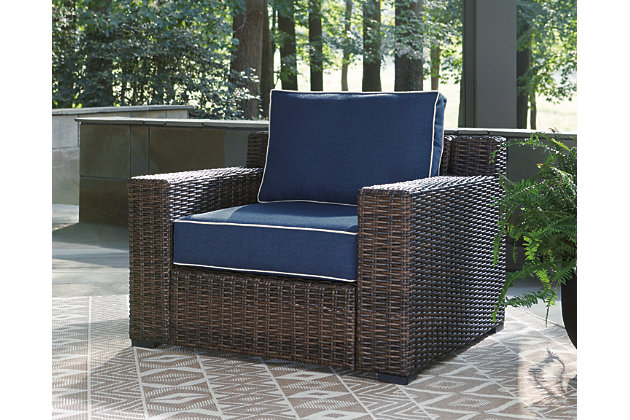 Style. Comfort. Quality. Value. The Grasson Lane lounge chair with cushion really goes to town, giving you the total package for outstanding outdoor living. Crafted to withstand the elements, this outdoor chair’s resin wicker base and rust-proof aluminum frame ensure carefree living, while the plush cushion covered in fade-resistant Nuvella® fabric provides stylish appeal. Comfy and casual, it's perfect for use inside or out.Outdoor lounge chair with cushion | All-weather resin wicker handwoven over durable aluminum frame | Powder coated aluminum resists rusting and fading | Zippered cushion covered in high-performing Nuvella® fabric | All-weather foam cushion core wrapped in soft polyester | Imported fabric and fill | Clean fabric with mild soap and water, let air dry; for stubborn stains, use a solution of 1 cup bleach to 1 gallon water | Assembly required | Estimated Assembly Time: 30 Minutes
