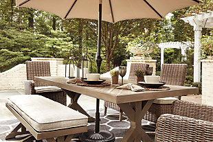 Sporting an easy-on-the-eyes look inspired by driftwood, the Beachcroft dining table elevates the art of indoor-outdoor living. Beautiful and durable enough for indoor and outdoor use, this high-style/low-maintenance table charms with X-leg farmhouse styling and wows with a thick porcelain table top that’s a natural complement.Comfortably accommodates 6-8, chairs sold separately | All-weather, rust-resistant, powder coated aluminum base | Porcelain tabletop | Umbrella hole; cap included | Sponge clean with damp cloth | Assembly required | Umbrella sold separately | Estimated Assembly Time: 30 Minutes