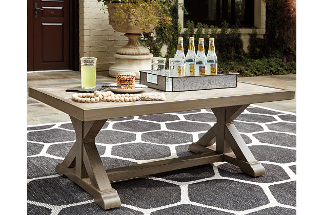 Sporting an easy-on-the-eyes look inspired by driftwood, the Beachcroft coffee table elevates the art of indoor-outdoor living. Beautiful and durable enough for indoor and outdoor use, this high-style/low-maintenance table charms with X-leg farmhouse styling and wows with a thick porcelain table top that’s a natural complement.All-weather, rust-resistant, powder coated aluminum base | Porcelain table top | Sponge clean with damp cloth | Assembly required | Excluded From Promotional Discounts | Estimated Assembly Time: 15 Minutes