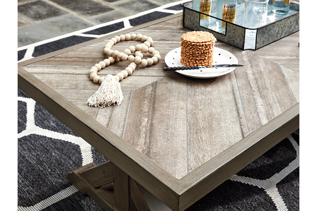 Sporting an easy-on-the-eyes look inspired by driftwood, the Beachcroft coffee table elevates the art of indoor-outdoor living. Beautiful and durable enough for indoor and outdoor use, this high-style/low-maintenance table charms with X-leg farmhouse styling and wows with a thick porcelain table top that’s a natural complement.All-weather, rust-resistant, powder coated aluminum base | Porcelain table top | Sponge clean with damp cloth | Assembly required | Excluded From Promotional Discounts | Estimated Assembly Time: 15 Minutes