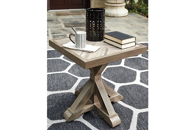 Sporting an easy-on-the-eyes look inspired by driftwood, the Beachcroft end table elevates the art of indoor-outdoor living. Beautiful and durable enough for indoor and outdoor use, this high-style/low-maintenance table charms with X-leg farmhouse styling and wows with a thick porcelain table top that’s a natural complement.All-weather, rust-resistant, powder coated aluminum base | Porcelain table top | Sponge clean with damp cloth | Excluded From Promotional Discounts