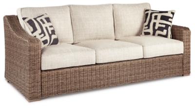 Sporting an easy-on-the-eyes look inspired by driftwood, the Beachcroft sofa elevates the art of indoor-outdoor living. Beautiful and durable enough for indoor and outdoor use, this high-style/low-maintenance sofa entices with plush, removable cushions wrapped in Nuvella® fabric that’s a breeze to keep clean.All-weather resin wicker handwoven over powder coated rust-proof aluminum frame | 2 throw pillows included | Zippered cushions and throw pillows covered in high-performing Nuvella® fabric | All-weather foam cushion core wrapped in soft polyester | Clean fabric with mild soap and water, let air dry; for stubborn stains, use a solution of 1 cup bleach to 1 gallon water | Imported fabric and fill | Assembly required | Estimated Assembly Time: 30 Minutes