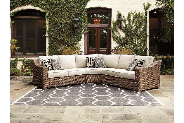 Sporting an easy-on-the-eyes look inspired by driftwood, the Beachcroft 5-piece seating set elevates the art of indoor-outdoor living. Beautiful and durable enough for indoor and outdoor use, the high-style/low-maintenance coffee table charms with X-leg farmhouse styling and wow with a thick porcelain tabletop that’s a natural complement. Sectional entices with plush, removable cushions wrapped in Nuvella® fabric that’s a breeze to keep clean.Includes right-arm facing loveseat, left-arm facing loveseat, 2 armless chairs, curved corner chair, coffee table  | Left-arm and "right-arm" describe the position of the arm when you face the piece | For indoor or outdoor use | All-weather, rust-resistant, powder coated aluminum base | Porcelain tabletops | All-weather resin wicker handwoven over powder coated rust-proof aluminum frame | Zippered cushions covered in high-performing Nuvella® fabric | All-weather foam cushion core wrapped in soft polyester | Curved corner includes 2 throw pillows; loveseats with 2 throw pillows each | Clean fabric with mild soap and water, let air dry; for stubborn stains, use a solution of 1 cup bleach to 1 gallon water | Imported fabric and fill | Sponge clean with damp cloth | Assembly required | Estimated Assembly Time: 100 Minutes