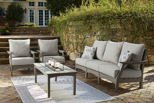 It’s the dawn of a new day for gray. Embrace the style trend with the Visola outdoor conversation set. Each piece is crafted of HDPE material, combining the exceptional durability and weather resistance you need with the “wood look” you love. The coffee table and comfortably cushioned seats take alfresco living to a whole new level. A slatted table top infuses a plank-style, farmhouse-inspired touch and naturally sheds rainwater. Rest assured, the thick cushions on the sofa and lounge chairs are wrapped in Nuvella® high-performance fabric that’s fade-resistant, stain-resistant and a breeze to keep clean.Includes sofa, 2 lounge chairs and coffee table | Made of durable and sturdy HDPE material | Gray finish with textured wood look | Stainless steel hardware | Throw pillows included | Seat/back cushions and pillows covered in solution-dyed Nuvella® (polyester) high-performance fabric | All-weather foam cushion core wrapped in soft polyester | Slatted table top | Clean fabric with mild soap and water, let air dry; for stubborn stains, use a solution of 1 cup bleach to 1 gallon water | Imported fabric and fill | Assembly required | Estimated Assembly Time: 90 Minutes