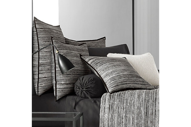 Update your bedroom with the uniquely modern style of this comforter set. The striking print features contrasting black and white brushstrokes to create a textured stripe for a refined, contemporary look that complements any decor.Made of 100% cotton | Plush polyfill | Black and gray reversible design | 1 queen comforter (92" x 96") | 2 shams (20" x 26" each) | 1 bedskirt (50" x 82" x 15") | Machine wash | Imported