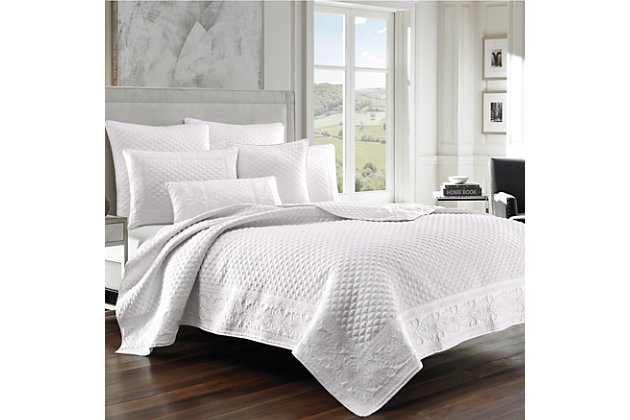 Add some luxury to your bedroom with this updated quilted coverlet. A matte satin captures the light in any bedroom. Detailed with an elegant foulard and damask embroidery, this piece elevates your space to something special.Made of 100% polyester | Plush polyfill | 1 king coverlet | Dry clean only | Imported