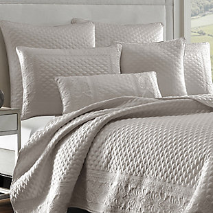 Add some luxury to your bedroom with this updated quilted coverlet. A matte satin captures the light in any bedroom. Detailed with an elegant foulard and damask embroidery, this piece elevates your space to something special.Made of 100% polyester | Plush polyfill | 1 full/queen coverlet | Dry clean only | Imported