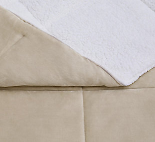 Indulge in a hint of color and loads of cozy comfort with this full/queen comforter set. Velvet face with square quilting reverses to a feel-good sherpa fabric in white for twice the softness.Set includes comforter and 2 shams | Polyester cover and fill | Velvet quilted front; sherpa back in white | Imported | Machine washable