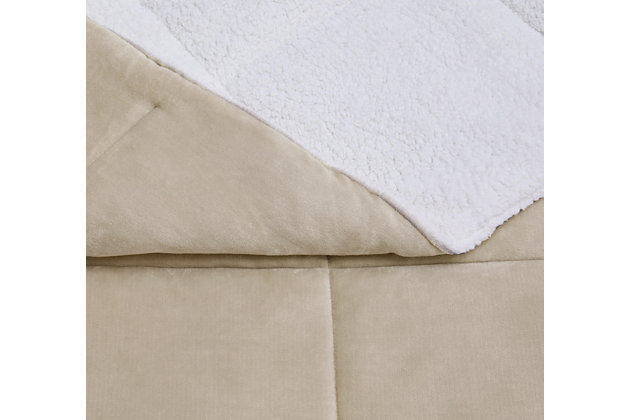 Indulge in a hint of color and loads of cozy comfort with this full/queen comforter set. Velvet face with square quilting reverses to a feel-good sherpa fabric in white for twice the softness.Set includes comforter and 2 shams | Polyester cover and fill | Velvet quilted front; sherpa back in white | Imported | Machine washable