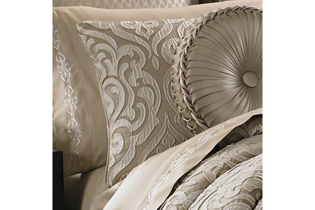 Traditional meets modern with the Astoria comforter set from J. Queen New York. The taupe ground of the comforter and shams sets the stage for this large scale damask pattern that creates a unique three dimensional effect, while the bed skirt offers a split corner diamond coordinate pattern and the hidden zipper pillow shams feature the damask motif in the center of each for a finished decorator look.100% polyester | Beige | Comforter set includes: 1 comforter, 2 pillow shams, 1 bed skirt | Made with design house quality fabric and craftsmanship | Timeless take on traditional patterns with an updated color palette | Dry clean only | Imported | Polyester fill