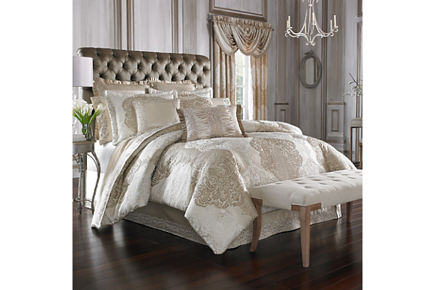 Grand scale opulence in rich tone of gold, mocha and ivory. The large scale ornate damask sets the stage for dramatic decorating. The comforter has been carefully cut and sewn to ensure that the intricate design is always perfectly centered. Giving the ensemble a custom look a unique finishing process gives the fabric a relaxed and three dimensional texture. The 4 pcs set includes: A tailored comforter, trimmed with a fine satin cord and reversing to a soft, smooth fabric. Oversized and overstuffed for a lofty look and feel. The set also includes a “box pleated” bed skirt that has a delicate border design to frame the solid satin drop. Two pillow shams are included in the set. Both pillow shams are perfectly cut and sewn to center the large and dramatic damask. They have two inch flanges and trimmed with a fine satin cord. The reverse is the elegant solid satin fabric using a hidden zipper for a soft touch. Both shams have padding on the face for extra loft.100% polyester | Gold | Comforter set includes: 1 comforter, 2 pillow shams, 1 bed skirt | Made with design house quality fabric and craftsmanship | Timeless take on traditional patterns with an updated color palette | Dry clean only | Imported | Polyester fill