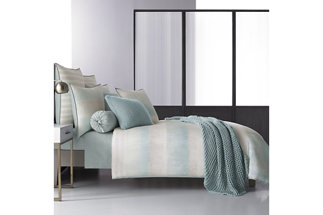 Update your bedroom with the uniquely modern style of the Oscar | Oliver Vince Duvet. This beautiful print features layered shades of aqua and neutrals to create soft sandy texture balanced by white stripes, and designed with thoughtful pattern placement to create an effortlessly soothing atmosphere in your bedroom.
The oversized duvet is completely reversible, with ultra-soft 100% brushed cotton on both sides for ultimate versatility.100% Cotton | Blue | Features a hidden button closure  | Made with design house quality fabric and craftsmanship  | Timeless take on traditional patterns with an updated color palette  | Dry clean only | Imported