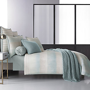 Update your bedroom with the uniquely modern style of the Oscar | Oliver Vince Duvet. This beautiful print features layered shades of aqua and neutrals to create soft sandy texture balanced by white stripes, and designed with thoughtful pattern placement to create an effortlessly soothing atmosphere in your bedroom.
The oversized duvet is completely reversible, with ultra-soft 100% brushed cotton on both sides for ultimate versatility.100% Cotton | Blue | Features a hidden button closure  | Made with design house quality fabric and craftsmanship  | Timeless take on traditional patterns with an updated color palette  | Dry clean only | Imported