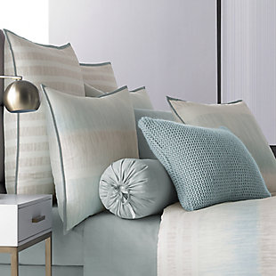 Update your bedroom with the uniquely modern style of Oscar Oliver Vince Comforter Set. This beautiful print features layered shades of aqua and neutrals to create soft sandy texture balanced by white stripes, and designed with thoughtful pattern placement to create an effortlessly soothing atmosphere in your bedroom.
The oversized and overfilled comforter is completely reversible, with ultra-soft 100% brushed cotton on both sides.
The 4 pcs set includes : One luxury cotton printed comforter. Two softly padded, perfectly matched pillow shams with a beautiful stripe section centered perfectly and fine aqua binding and a conveniently hidden zipper. One tailored brushed cotton bed skirt in solid aqua, with split corners and a 15" drop.100% cotton | Blue | Comforter set includes: 1 comforter, 2 pillow shams, 1 bed skirt | Made with design house quality fabric and craftsmanship | Timeless take on traditional patterns with an updated color palette | Dry clean only | Imported | Polyester fill