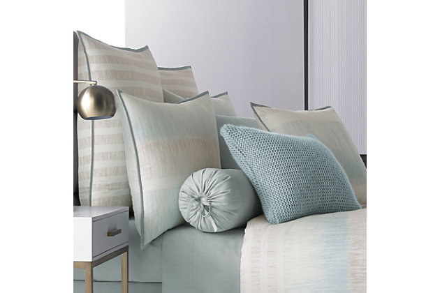 Update your bedroom with the uniquely modern style of Oscar Oliver Vince Comforter Set. This beautiful print features layered shades of aqua and neutrals to create soft sandy texture balanced by white stripes, and designed with thoughtful pattern placement to create an effortlessly soothing atmosphere in your bedroom.
The oversized and overfilled comforter is completely reversible, with ultra-soft 100% brushed cotton on both sides.
The 4 pcs set includes : One luxury cotton printed comforter. Two softly padded, perfectly matched pillow shams with a beautiful stripe section centered perfectly and fine aqua binding and a conveniently hidden zipper. One tailored brushed cotton bed skirt in solid aqua, with split corners and a 15" drop.100% cotton | Blue | Comforter set includes: 1 comforter, 2 pillow shams, 1 bed skirt | Made with design house quality fabric and craftsmanship | Timeless take on traditional patterns with an updated color palette | Dry clean only | Imported | Polyester fill