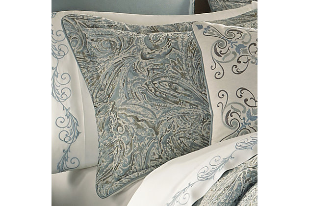 Giovani is a large woven paisley design. Tones of spa and cream create this custom bedding collection. The oversized comforter is embellished with a solid blue twill piping. The 4 pcs set includes: One beautifully designed comforter. Two perfectly matched padded pillow shams with a hidden zipper. Pillow shams are engineered to offer a one of a kind decorator look, the paisley design is finished with solid piping. The bed skirt is solid blue twill with a 2” border of the paisley design and contains split corners and a 15" drop.100% polyester | Blue | Comforter set includes: 1 comforter, 2 pillow shams, 1 bed skirt | Made with design house quality fabric and craftsmanship | Timeless take on traditional patterns with an updated color palette | Dry clean only | Imported | Polyester fill