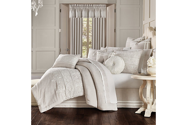 Lauralynn is a beautifully embroidered bedding collection. Cream embroidery runs horizontal across the beige faux linen comforter. The embroidery is an elegant damask design. The oversized comforter is embellished with 1/4" beige piping. The four piece set includes one comforter and two perfectly matched padded pillow shams with a hidden zipper. The pillow shams are engineered, centering the embroidered damask and finished with 1/4" beige piping. The bed skirt is solid faux linen beige with 2 rows of gimp running at the bottom. The bed skirt contains split corners and a 15" drop.100% polyester | Beige | Comforter set includes: 1 comforter, 2 pillow shams, 1 bed skirt | Made with design house quality fabric and craftsmanship | Timeless take on traditional patterns with an updated color palette | Dry clean only | Imported | Polyester fill