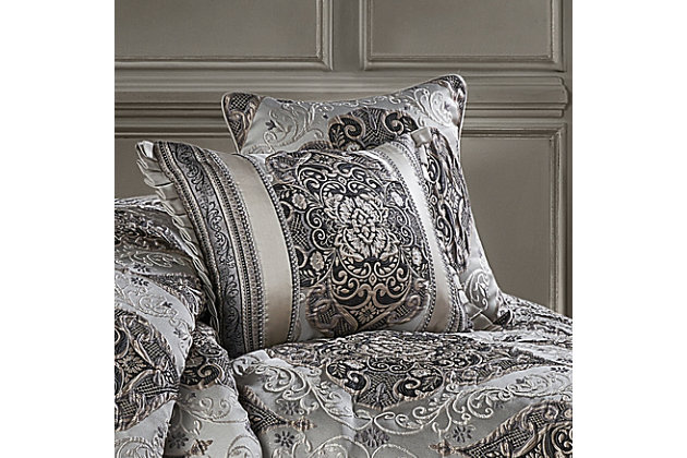 The Desiree 18" Decorative Throw Pillow is exquisite with its bold use of black and silver tones. This beautiful square throw pillow is rich with a traditional woven jacquard damask design on the front and solid silver satin on the back and finished with a 1/4" silvertone piping. Pair this reversible pillow with the Desiree bedding set by J. Queen New York for a complete luxury look.100% polyester | Silver | Elegant accent pillow for your bedding, sofa, or armchair | Made with design house quality fabric and craftsmanship | Timeless take on traditional patterns with an updated color palette | Dry clean only | Imported | Polyester fill