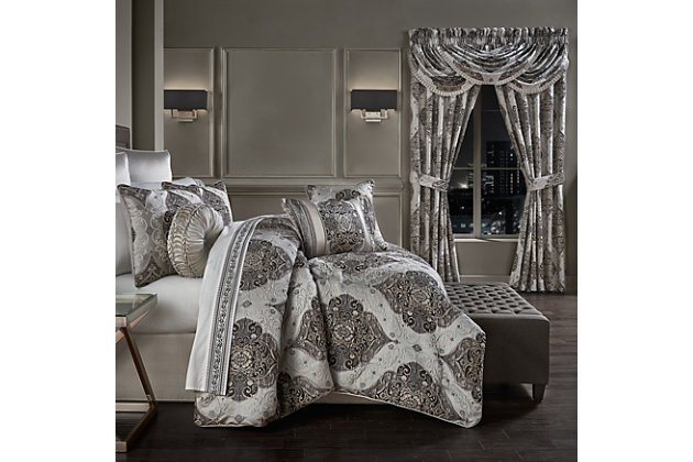 The Desiree 4 Piece Comforter Set Bedding Collection is exquisite with its fine details and bold use of black and silver tones. This beautiful woven jacquard damask pattern is rich with its 3-dimensional weave and satin finish. Paired with matching hidden zipper pillow shams and a silver satin split corner bed skirt, this oversized ensemble will add sophisticated elegance to your bedroom decor. The reverse of this set is a soft microfiber dyed to match the silver base of the pattern on the front. Finished with a 1/4" silvertone piping. Pair this bedding collection with the Desiree throw pillows, shams, and window treatments for a complete luxury look.100% polyester | Silver | Comforter set includes: 1 comforter, 2 pillow shams, 1 bed skirt | Made with design house quality fabric and craftsmanship | Timeless take on traditional patterns with an updated color palette | Dry clean only | Imported | Polyester fill