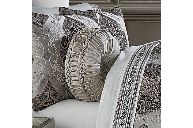 The Desiree Tufted Round Pillow uses a beautiful silver satin fabric to create a one of a kind accent piece to your bedding ensemble. This 15" uniquely constructed pillow is sewn by hand and is finished with a fabric covered button on both sides. Pair it with the Desiree bedding set by J. Queen New York for a complete luxury look.100% polyester | Silver | Elegant accent pillow for your bedding, sofa, or armchair | Made with design house quality fabric and craftsmanship | Timeless take on traditional patterns with an updated color palette | Dry clean only | Imported | Polyester fill