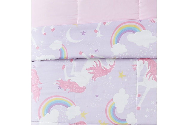Turn your little one's room into a whimsical spot with this three-piece unicorn comforter set. Its magical unicorns, rainbows and moons against a pink and purple background create the perfect setting for daytime and dreaming. The included accent pillow, with a large unicorn on it, completes the look.Set includes 1 comforter, 1 pillow sham and 1 accent pillow | Purple and pink | Made of microfiber polyester with polyester fiber fill | Reversible to solid pink | Machine washable | Imported