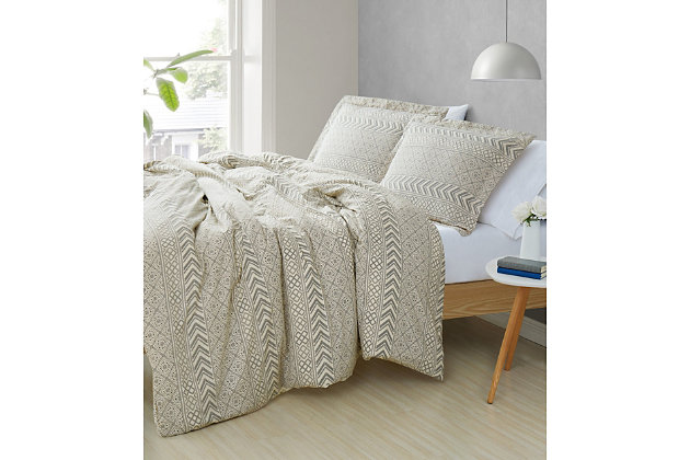 Neutralize your bedroom in an inspired way with this gorgeous duvet set that entices with a tile style print with horizontal bands and a solid tone reverse for pretty contrast. How beautifully it sets the scene for everyday luxury. Rest assured, its cotton face fabric is the stuff dreams are made of. Duvet only; comforter insert not included.100% cotton woven face with a printed pattern; 100% microfiber polyester woven fabric back | Imported | Machine washable; must be washed in appropriate size equipment to avoid damage | Includes: one king duvet cover 104x90 inches and two king shams 20x36 inches; comforter insert is not included and must be purchased separately.