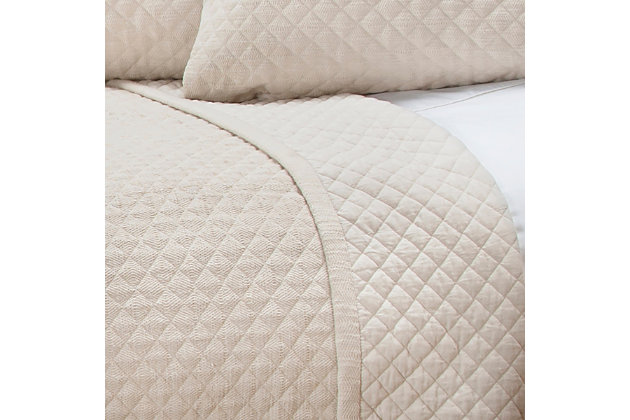 Shifting into neutral? You’ll love how this quilt with cotton face looks and feels. Rest assured, a textural design with diamond pattern gives the calm and quiet hue just enough oomph. 100% cotton face  | Textured diamond pattern machine quilting with pipined edge  | Machine wash cold, gentle cycle, tumble dry low, do not bleach | Imported | Polyester fill | Shams not included