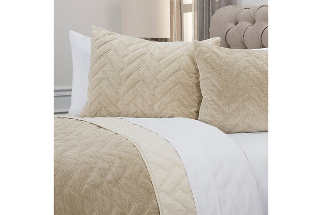 Longing for a soothing, subtle look for your bedroom retreat? This simply sensational quilt can’t be beat. Its easy-breezy neutral tone is enriched with chevron texturing for a high-style understatement that’s the essence of effortless elegance.100% cotton face  | Machine and hand quilted | Dry clean only | Imported | Polyester fill | Shams not included