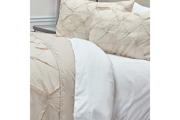 
Diamond life. In the mood for luxury? This designer quilt with cotton face is such an indulgent choice.  Its neutral hue is complemented with a textural diamond design sure to make a high-style statement. What an instant bedroom refresh.100% cotton face  | Hand-guided machine quilting in a diamond pattern; hand-tucked pleating  | Machine wash cold, gentle cycle, tumble dry low, do not bleach | Imported | Polyester fill | Shams not included