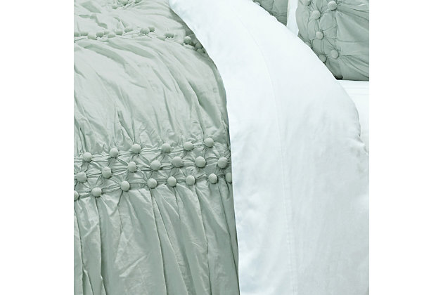 Have a ball outfitting your bedroom with this cotton quilt loaded with posh puckered texture and a soothing hue. Incorporation of handmade cotton balls makes it all the more enticing.100% cotton face  | Texture created by handmade cotton balls | Machine wash cold, gentle cycle, tumble dry low, do not bleach | Imported | Polyester fill | Shams not included