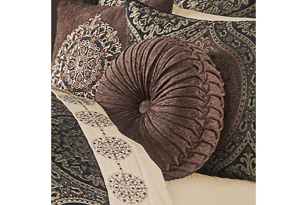 The Mahogany Tufted Round Pillow uses a beautiful chocolate chenille fabric to create a one of a kind accent to this bedding ensemble. This 15" unique round throw pillow is sewn by hand and it finished with a fabric covered button on both sides. Pair it with the Mahogany bedding set by J. Queen New York for a complete look.Elegant accent pillow for your bedding, sofa, or armchair. | Made with design house quality fabric and craftsmanship. | Timeless take on traditional patterns with an updated color palette. | Dry clean | Imported | Polyester