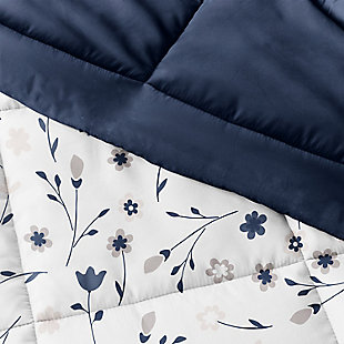 The perfect comforter to keep you cozy all year round. The Down Alternative Forget Me Not Patterned reversible comforter set from the Home Collection features the perfect loft and Down-like feel to keep you warm and toasty while you sleep. Designed for healthy living and 100% hypoallergenic for allergy sufferers, this luxury comforter presents a quality alternative to Down with incredible loft and end to end baffle-box construction, preventing fiber from shifting, eliminating the need for regular fluffing.Twin Size Set Includes: 1 Comforter: 70" x 90", 1 Standard Sham: 20" x 26" (2" flange) | Light-weight shell for exceptional softness and drape | Generous baffle box stitching for optimum loft | Printed Forget Me Not pattern reverse to Navy | Evenly filled for superior warmth | Imported