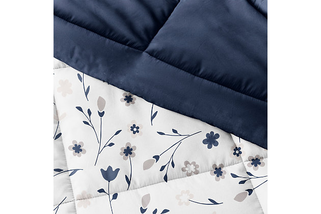 The perfect comforter to keep you cozy all year round. The Down Alternative Forget Me Not Patterned reversible comforter set from the Home Collection features the perfect loft and Down-like feel to keep you warm and toasty while you sleep. Designed for healthy living and 100% hypoallergenic for allergy sufferers, this luxury comforter presents a quality alternative to Down with incredible loft and end to end baffle-box construction, preventing fiber from shifting, eliminating the need for regular fluffing.Twin Size Set Includes: 1 Comforter: 70" x 90", 1 Standard Sham: 20" x 26" (2" flange) | Light-weight shell for exceptional softness and drape | Generous baffle box stitching for optimum loft | Printed Forget Me Not pattern reverse to Navy | Evenly filled for superior warmth | Imported